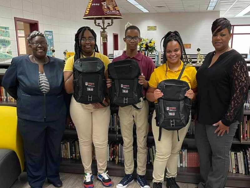 Local students receiving school supplies as part of UGA TRIO program