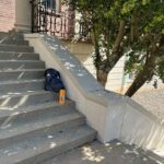 Stairs with a backpack and water bottle left behind.