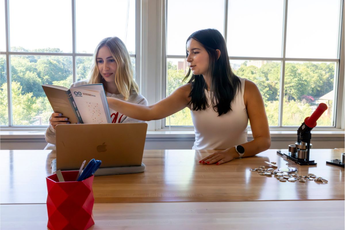 Two students collaborate on a project in UGA's Creative Engagement Wing