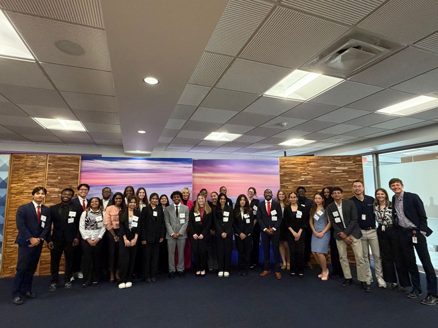 A group of students pose at Delta Headquarters during a UGA career site visit
