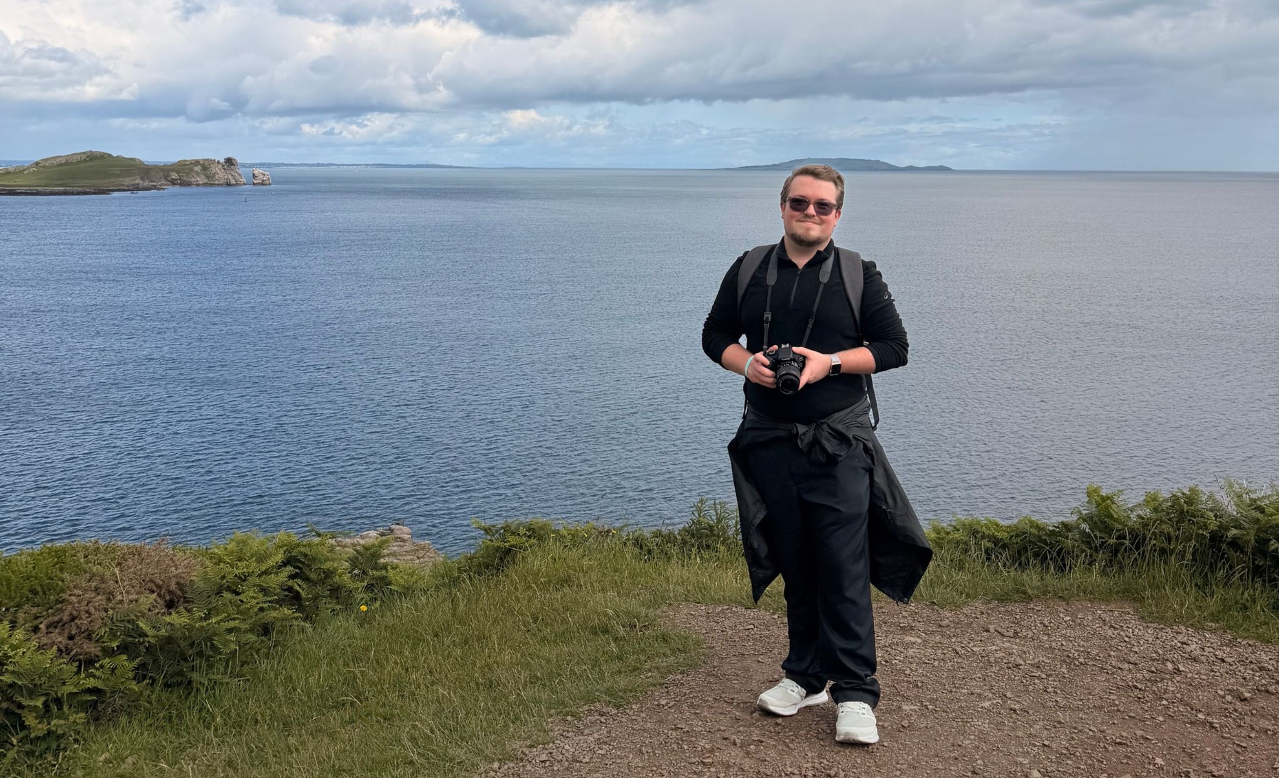 UGA student Travis Swain poses for a photo in front of a body of water in Ireland on a study away program in June 2026.