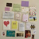 Collage on wall of thank you cards and post it notes.